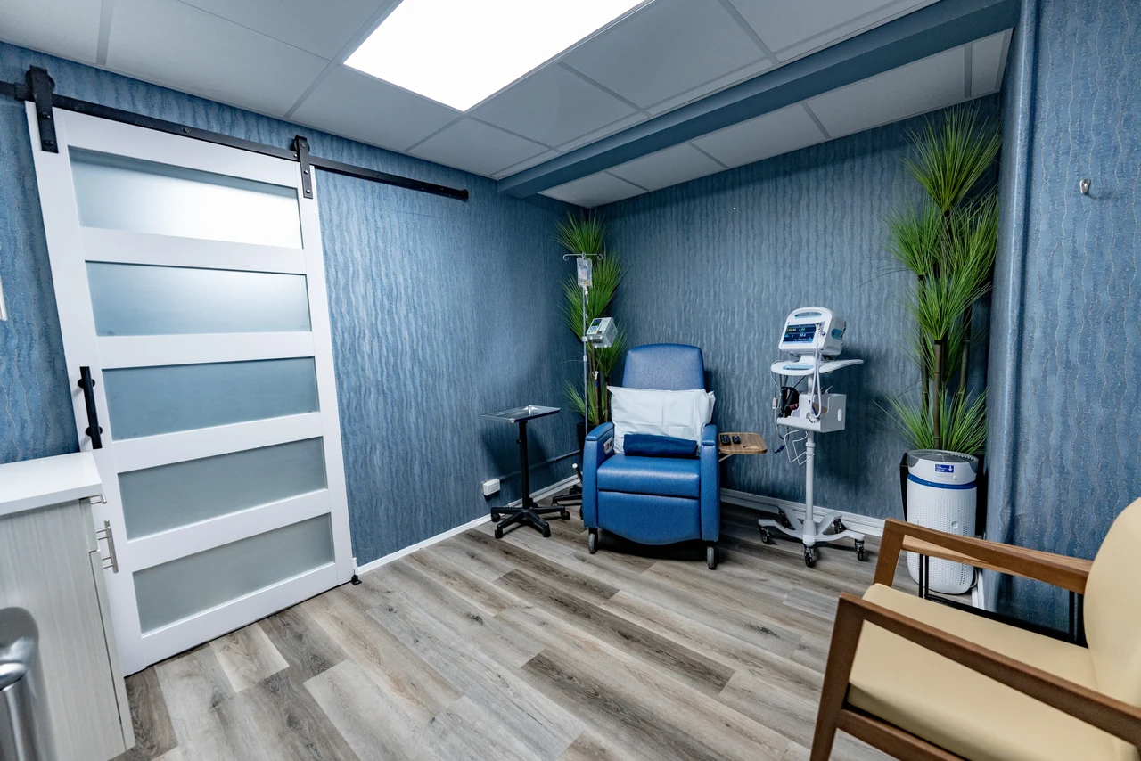 Private Thrivewell infusion treatment room with a reclining chair and infusion equipment