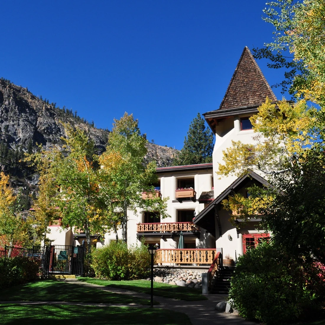Olympic Village Inn resort surrounded by trees and mountains