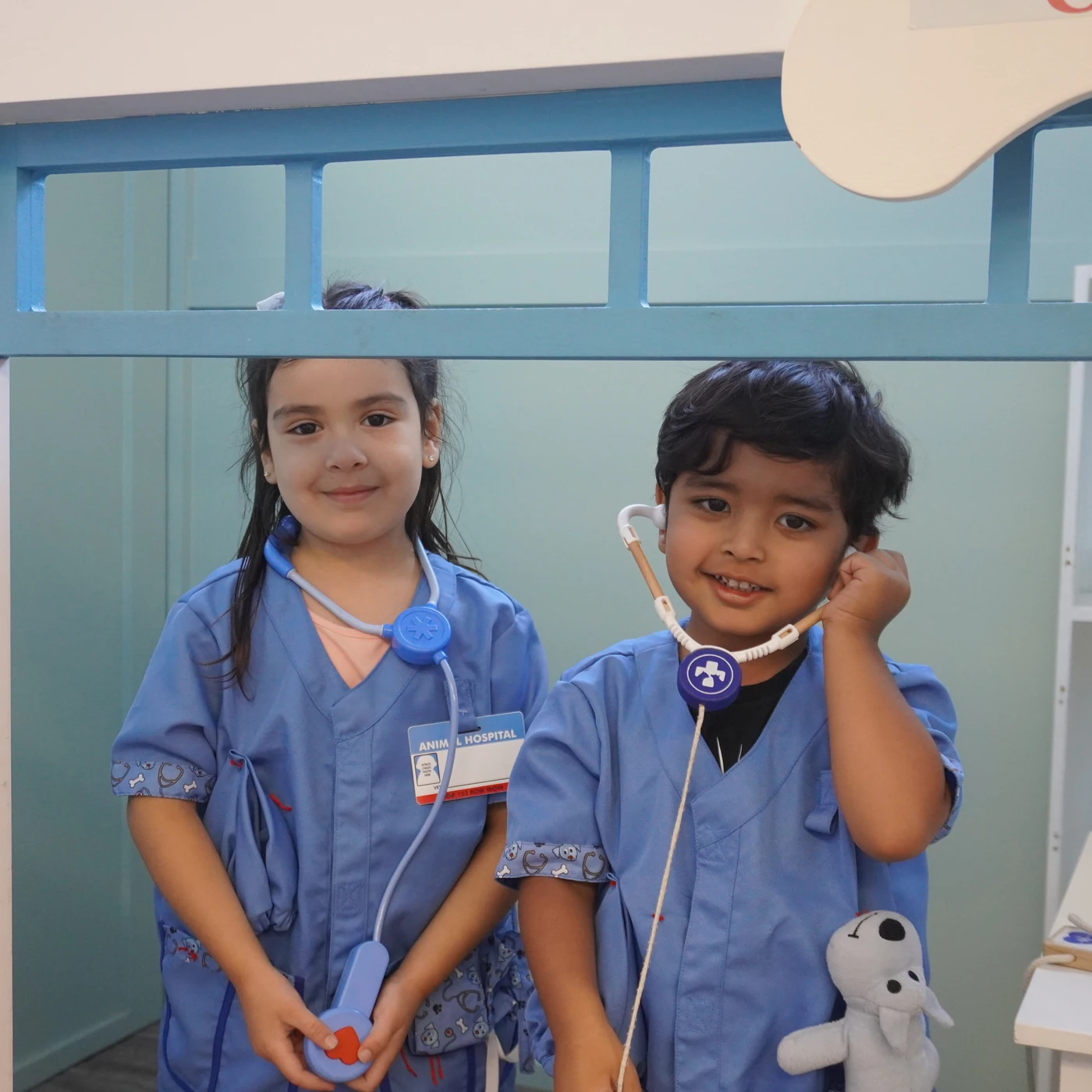 Two children exploring role play in a Building Kidz classroom
