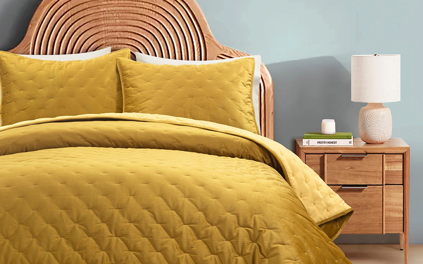 Lush Décor gold bedding in a styled bedroom with a rattan headboard