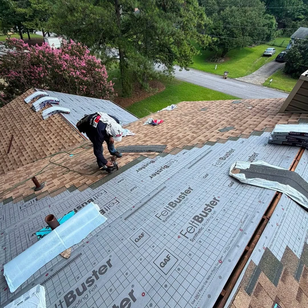 Results Roofing team member installing a residential roof