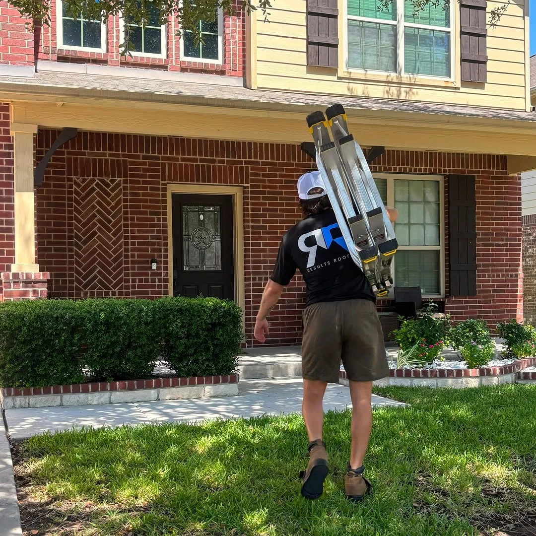 Results Roofing team member arriving with a ladder for a residential roofing project