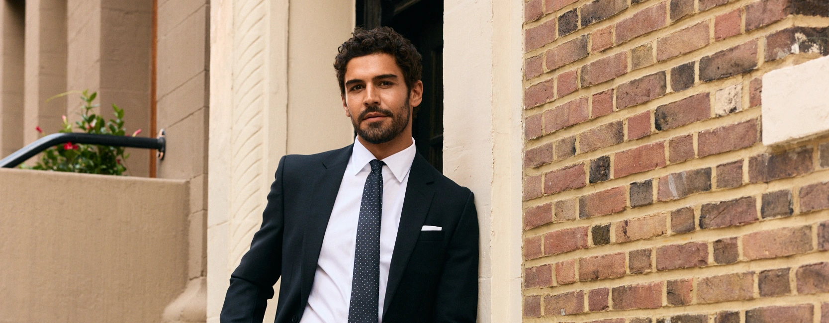 The Black Tux campaign featuring a navy suit on a New York street