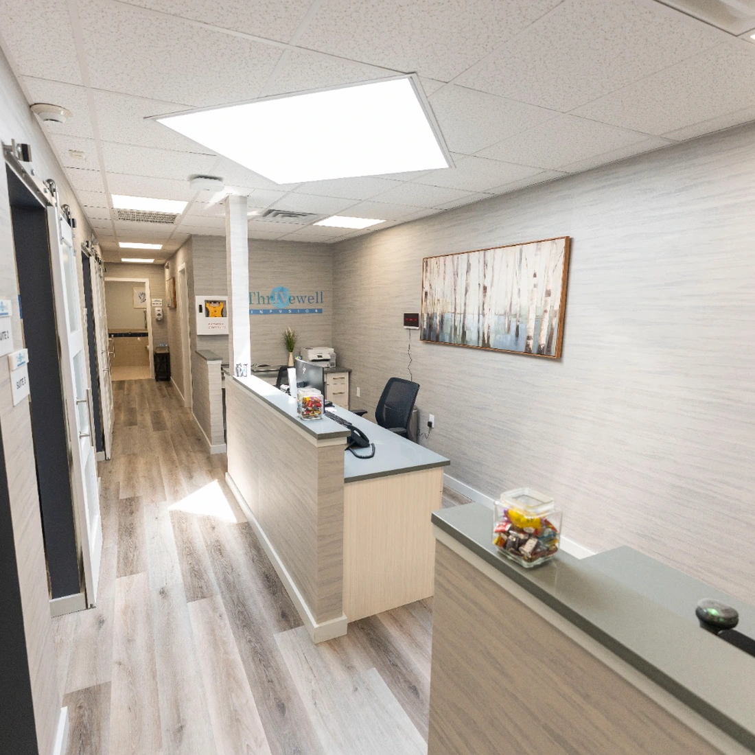Thrivewell Infusion reception desk and treatment-suite corridor