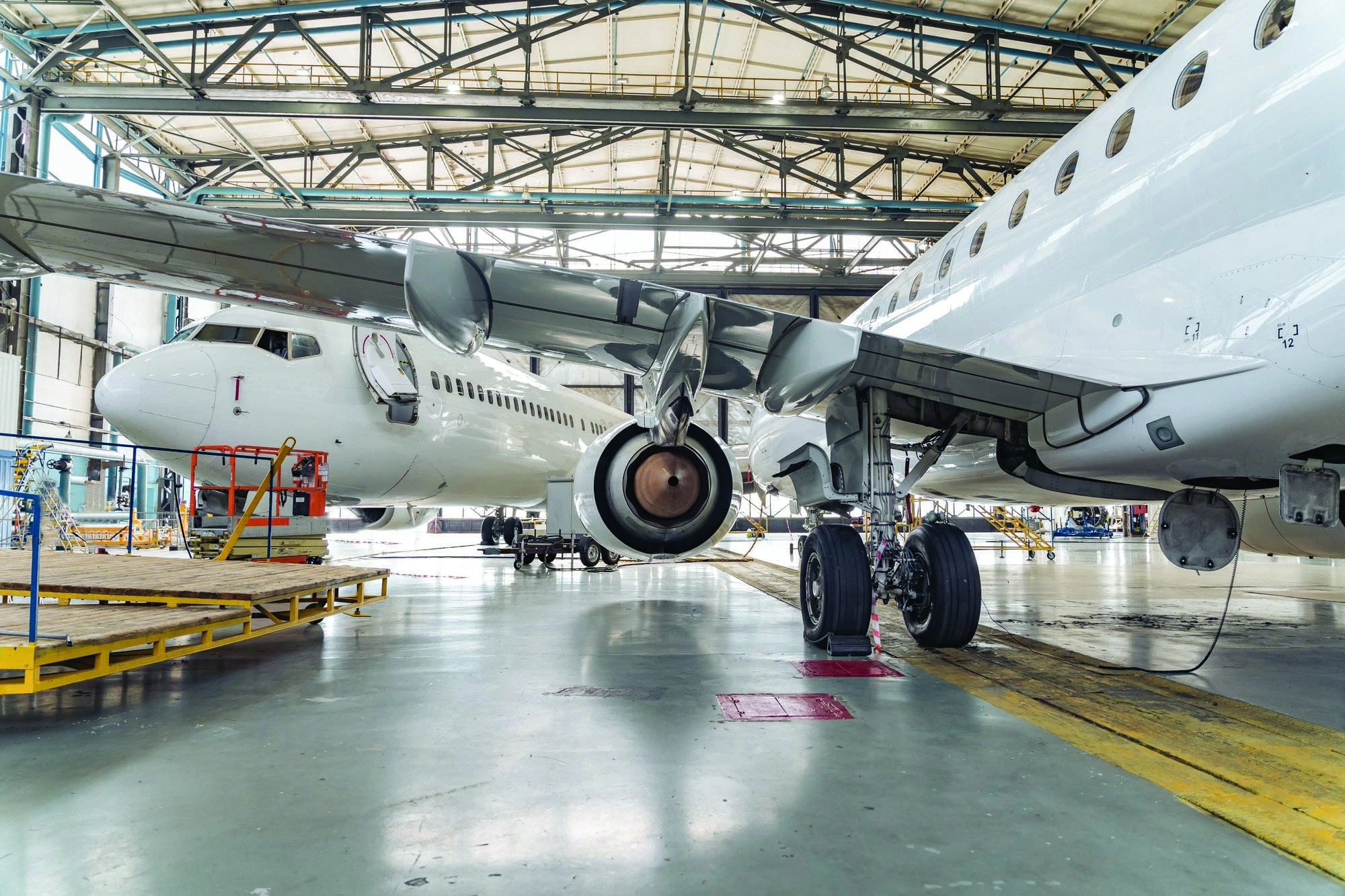 Aircraft undergoing maintenance inside a hangar, from TruVideo’s aviation whitepaper