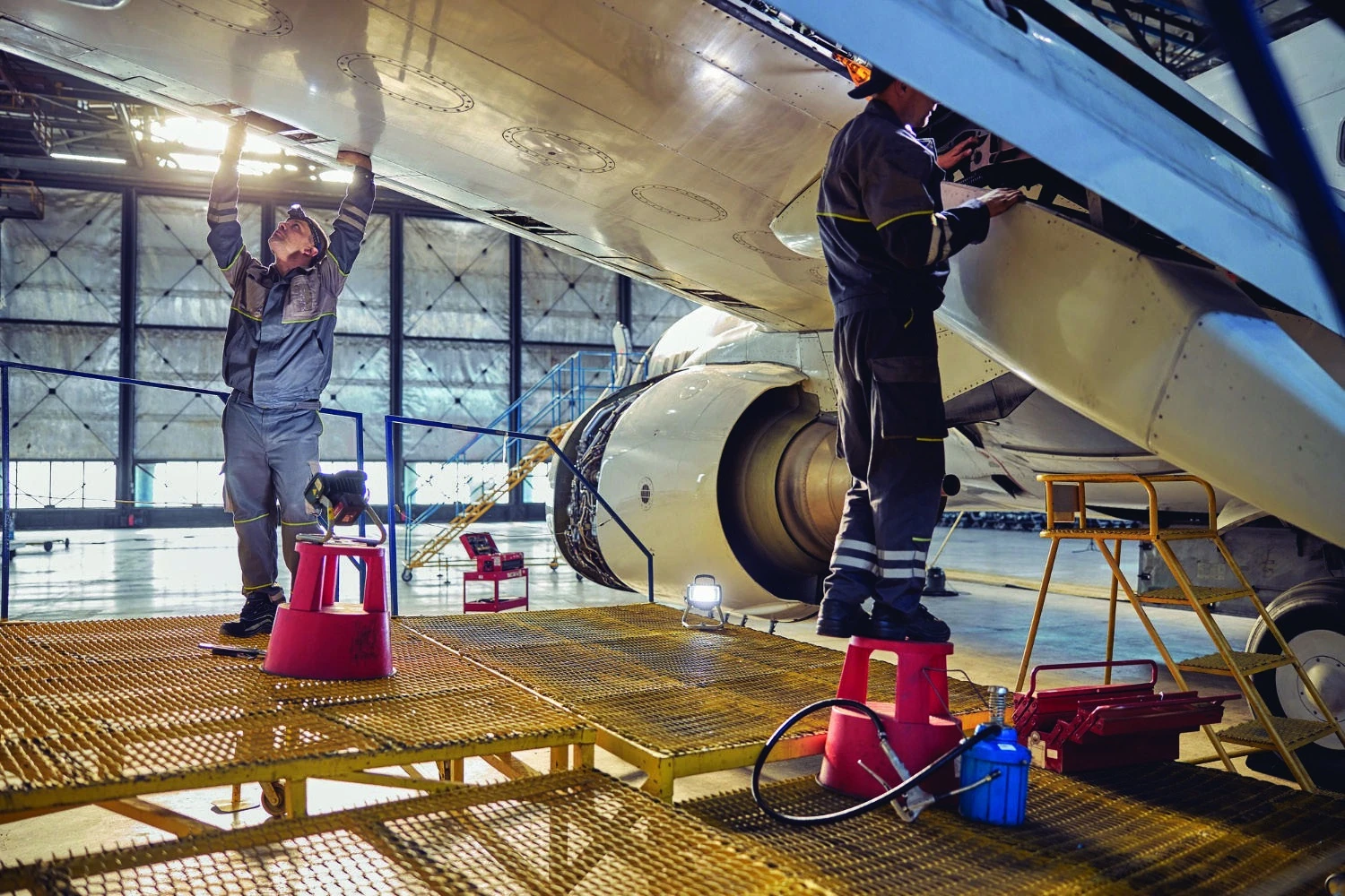 Aircraft maintenance technicians working in a hangar, from TruVideo’s aviation whitepaper