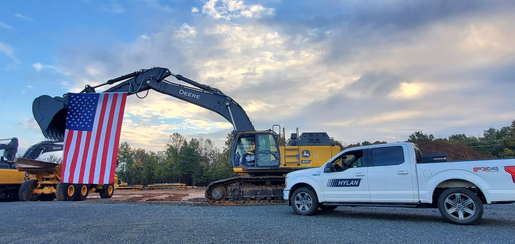 Hylan excavator and construction vehicle at an infrastructure work site